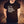 Man wearing black tshirt with Christian fish symbol